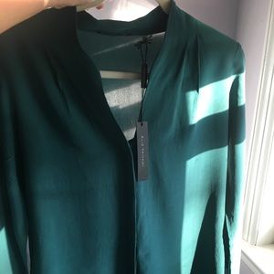 Tahari blouse has deodorant marks on the armpits.